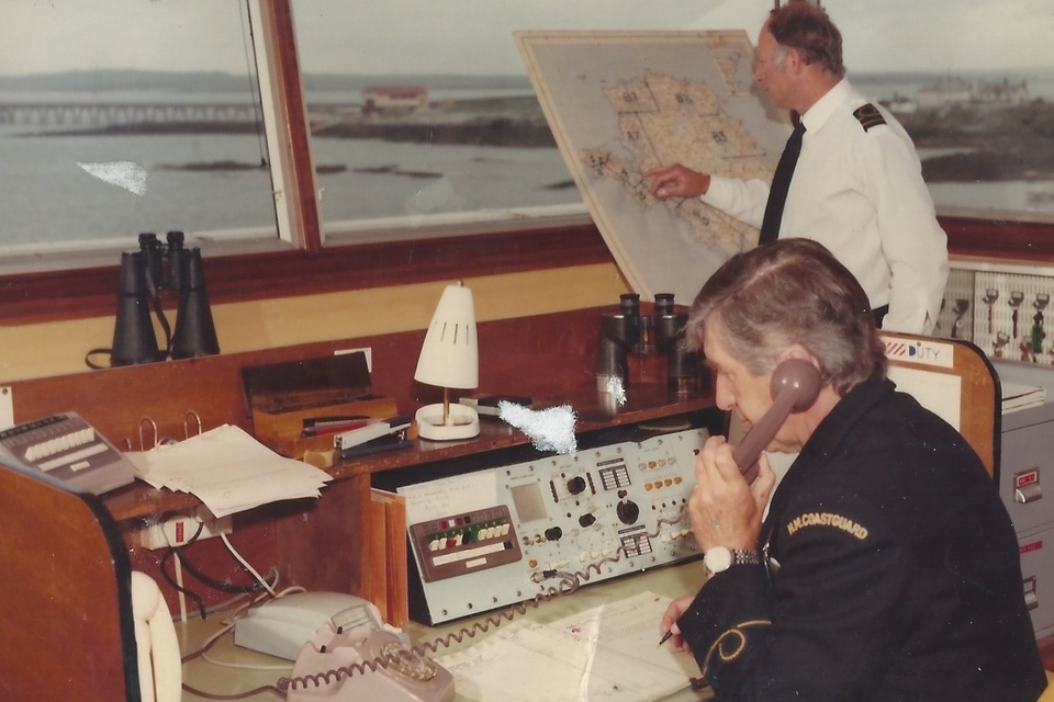 Two coastguards in the operations room at Holyhead around 1970