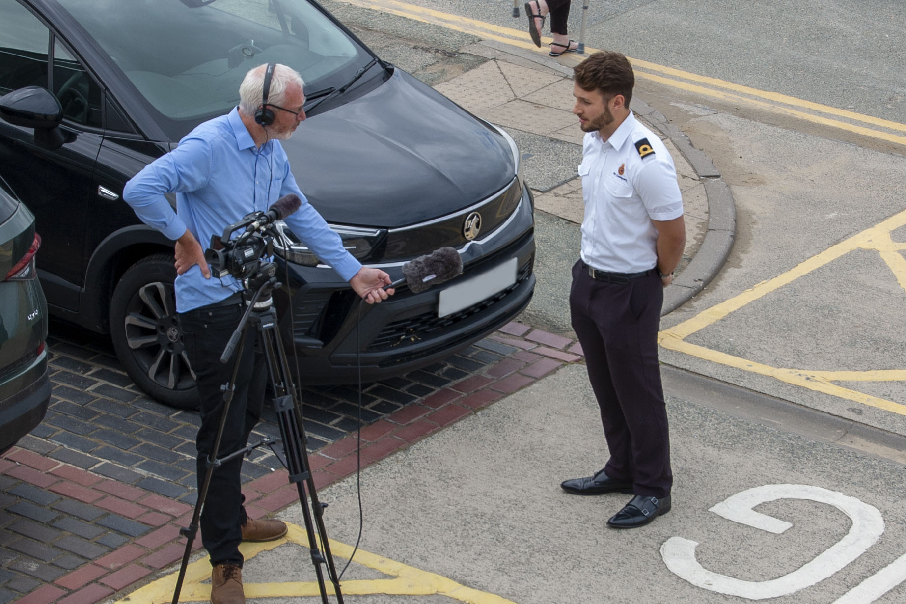 HM Coastguard Ben Miller being filmed during an interview