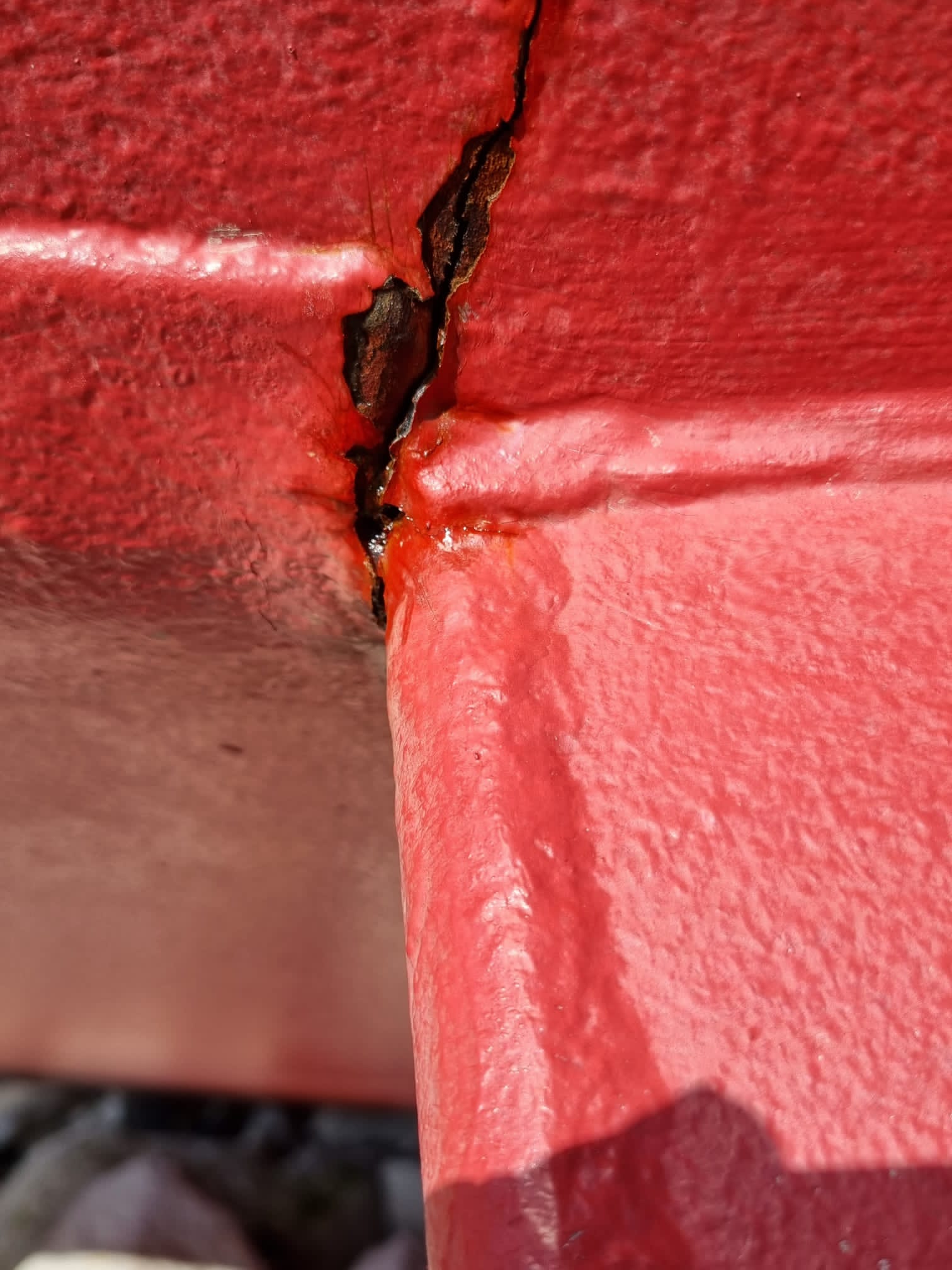Crack to red keel of a yacht