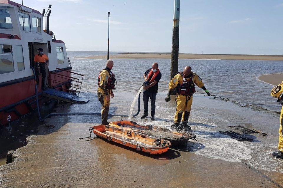 The team had a helping hand from the ferry crew and a hose down after a technical mud rescue of woman and her dog. Picture credit: Fleetwood Coastguard rescue team