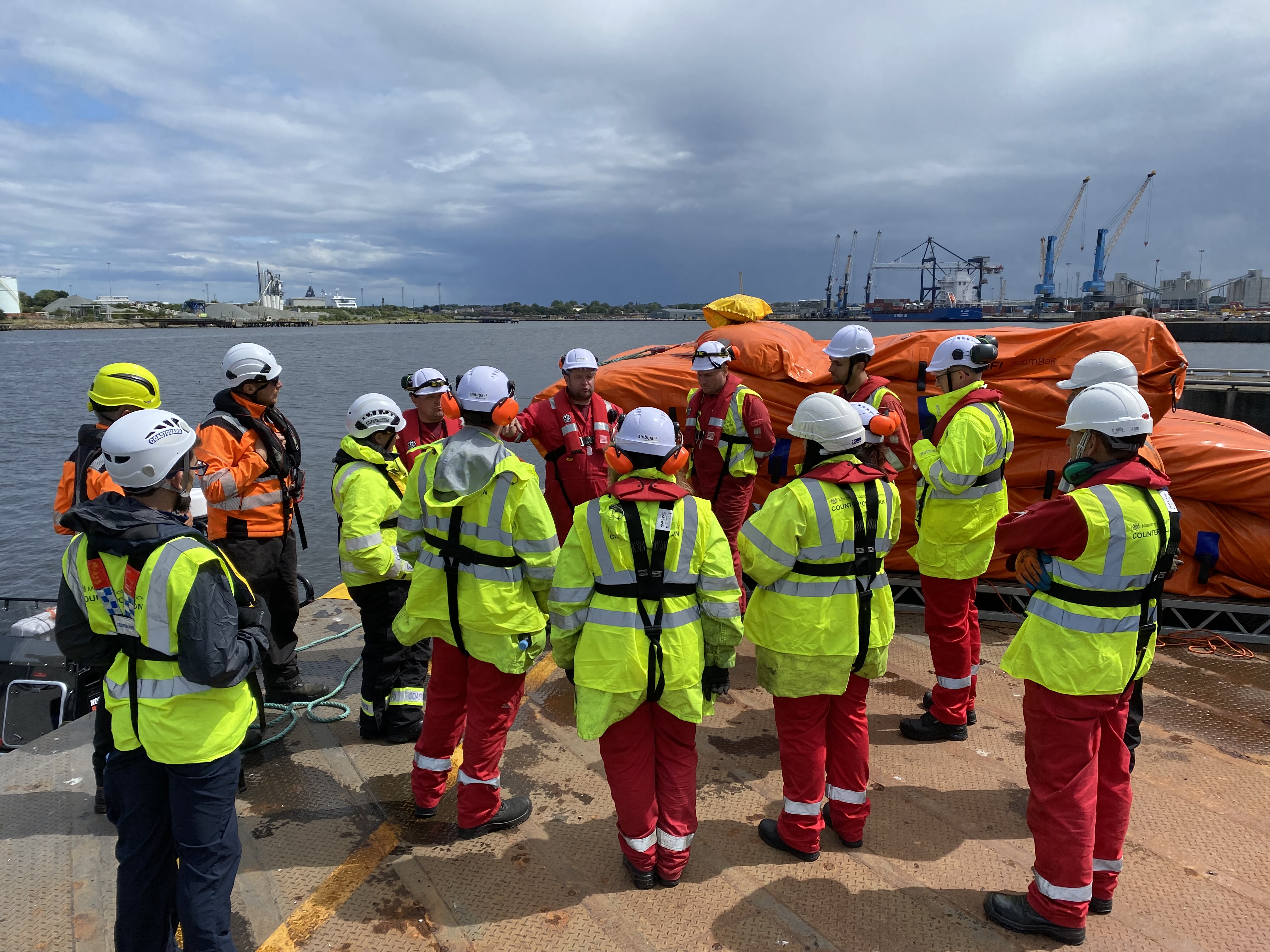 The team is briefed before going onto the water at the Port of Tyne