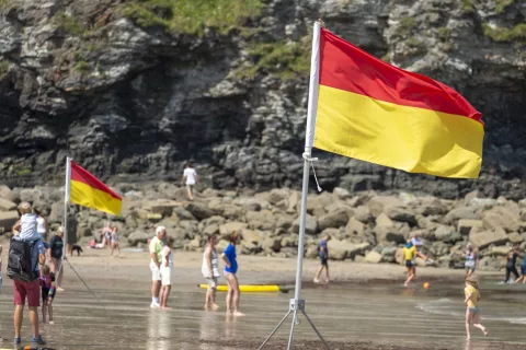 Red and yellow flags at a lifeguarded beach