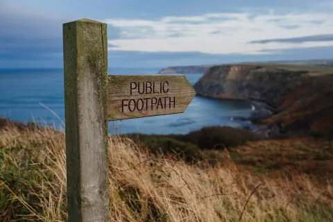 Sign on a coastal path.