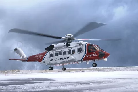 HM Coastguard rescue helicopter in the snow