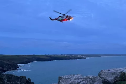 The Newquay-based Coastguard helicopter hovers over the scene at Trewavas Head