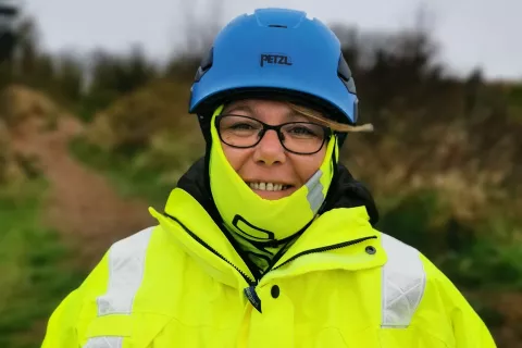 Claire Newman in coastguard uniform and blue helment