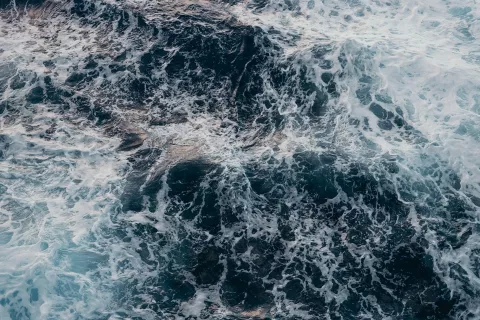 An aerial view of water in choppy conditions.