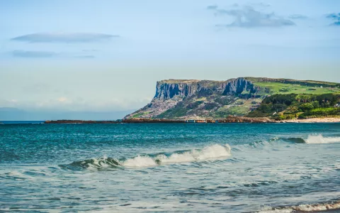 The North Coast of Northern Ireland from Ballycastle Beach in Country Antrim. In the background is the coast of Scotland