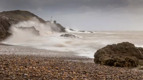 Stormy waves and spray hit cliff on UK coast