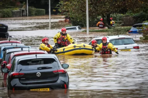 Coastguards provide an emergency response during Storm Babet flooding. 