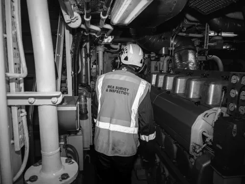 A marine surveyor inspecting a vessel