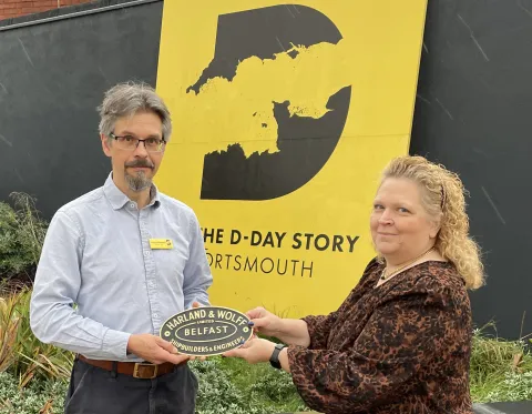 Andrew Whitmarsh is presented with the artefact by Andrea Bailey