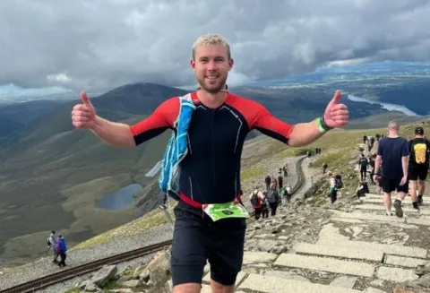 Fin McNab taking part in one of his triathlon events. 