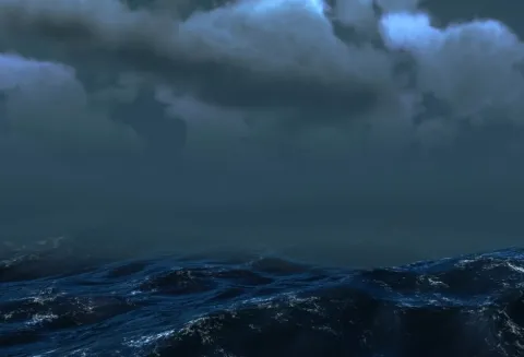 Stormy seas under a dark grey sky