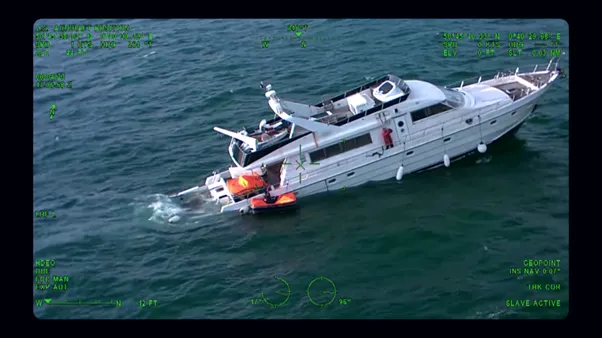 Birds eye view of yacht sinking from the back