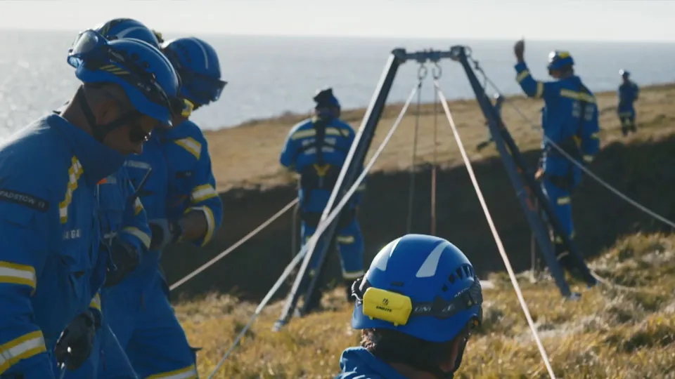 A coastguard rescue team performing a cliff rescue
