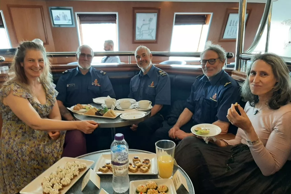 Guests enjoying food on board the ferry