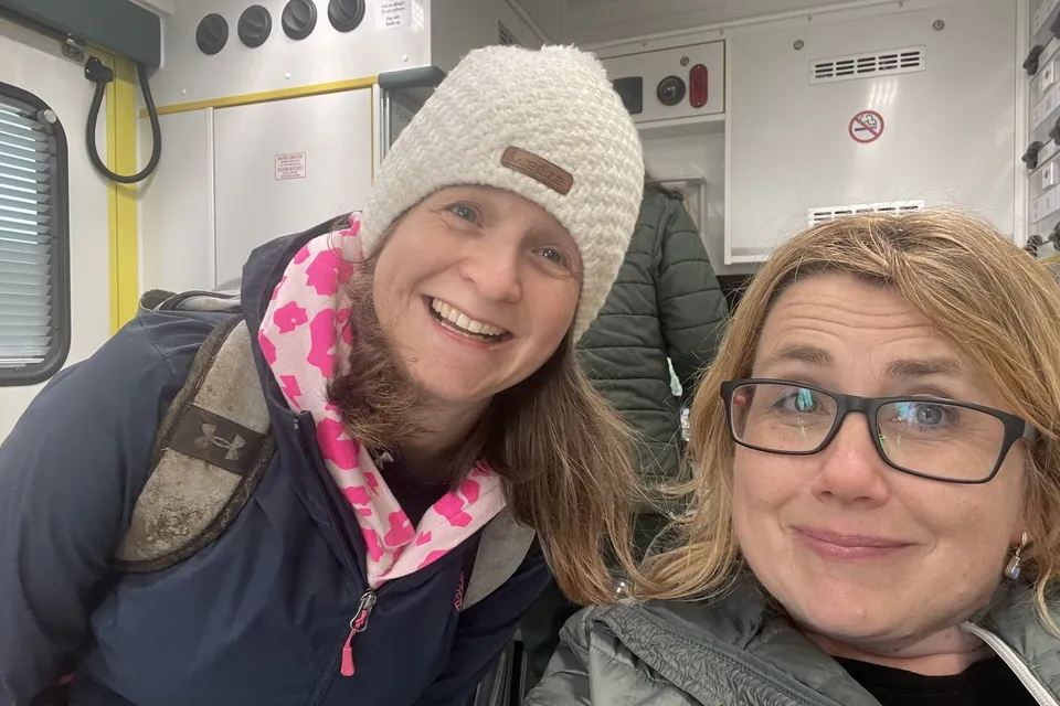 Cari Ormerod and friend smiling inside the ambulance after airlift in St Athans coastguard helicopter