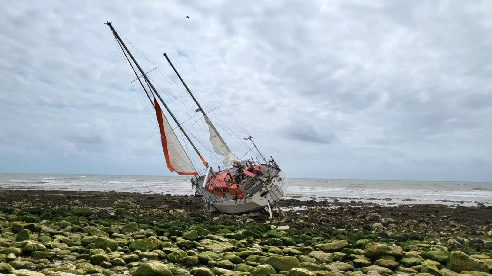 Vessel aground on chalky beach