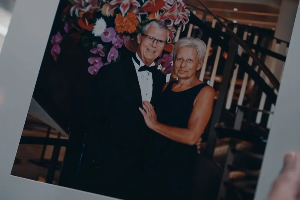A printed photograph of a man and a woman dressed smartly