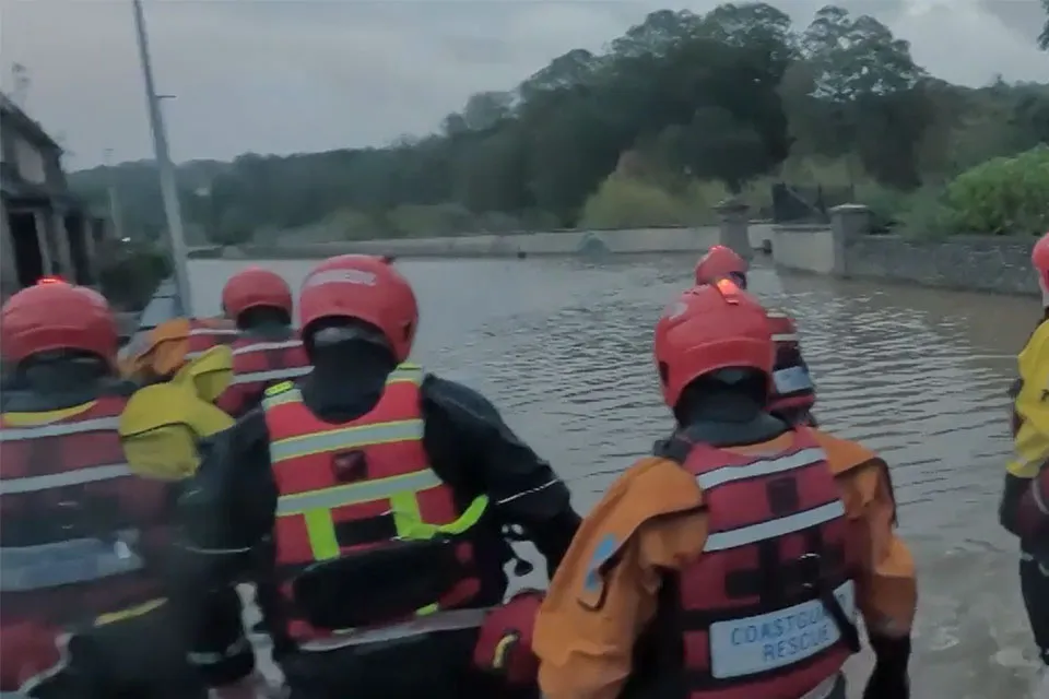 Coastguard rescue officers attending the Storm Babet floods