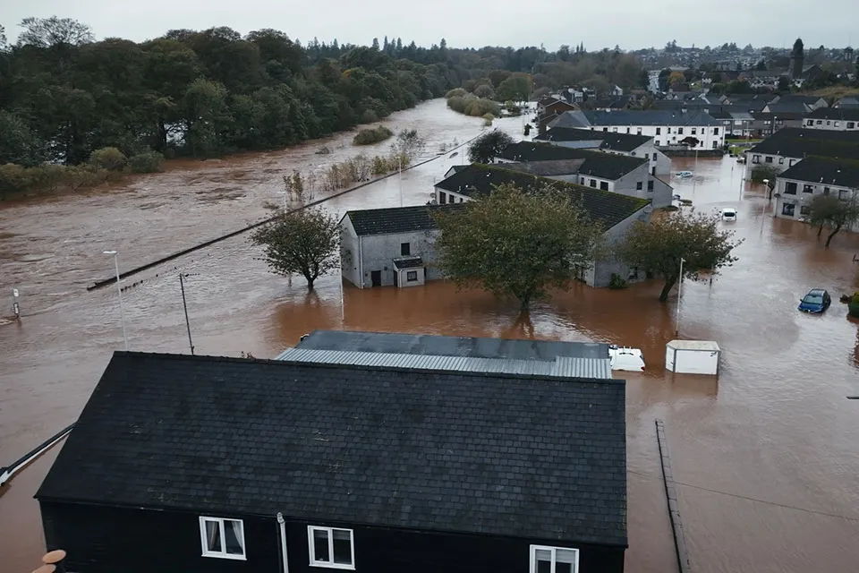 Aerial view of the holiday park with flood water surrounding the caravans and lodges