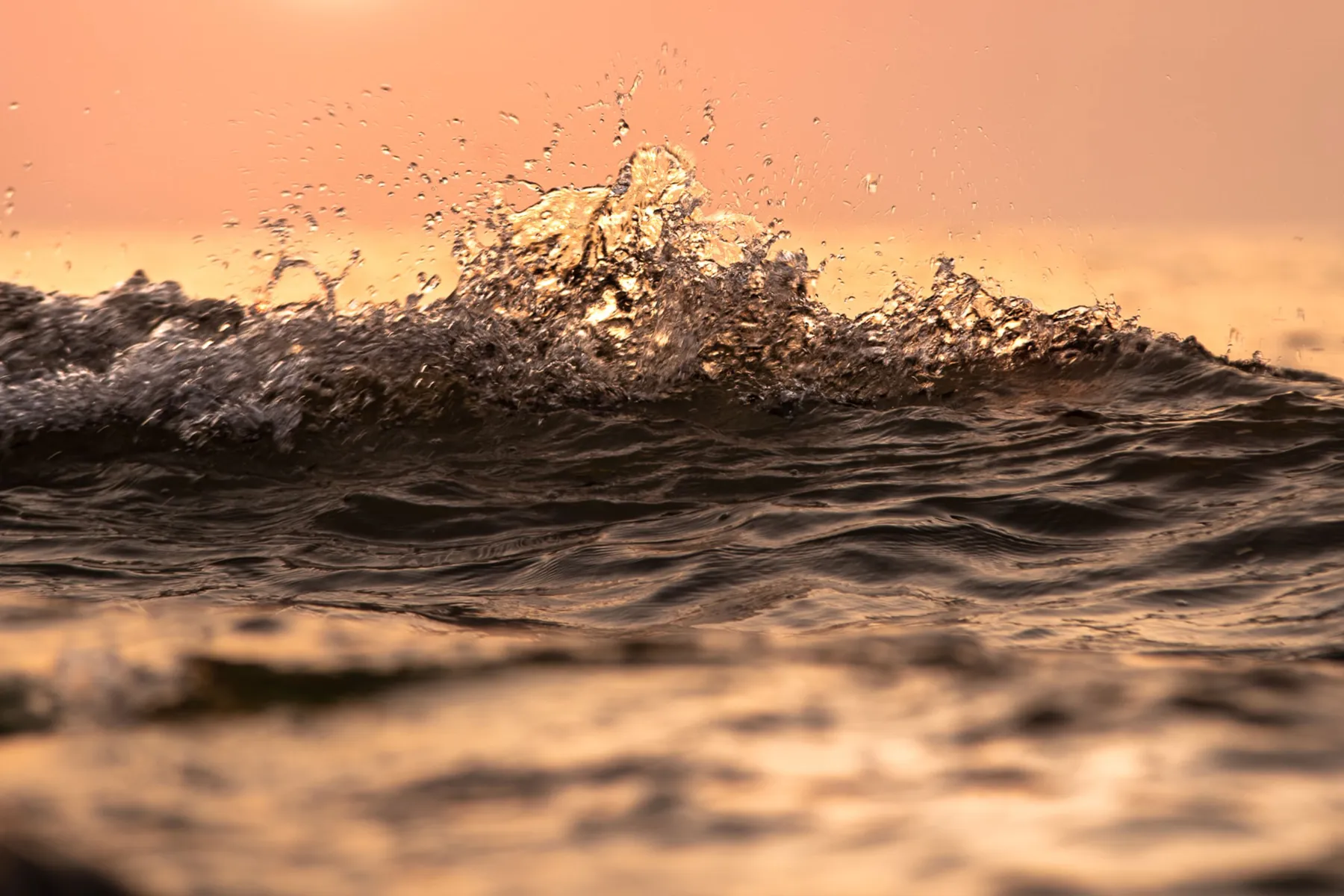 Sunset over waves