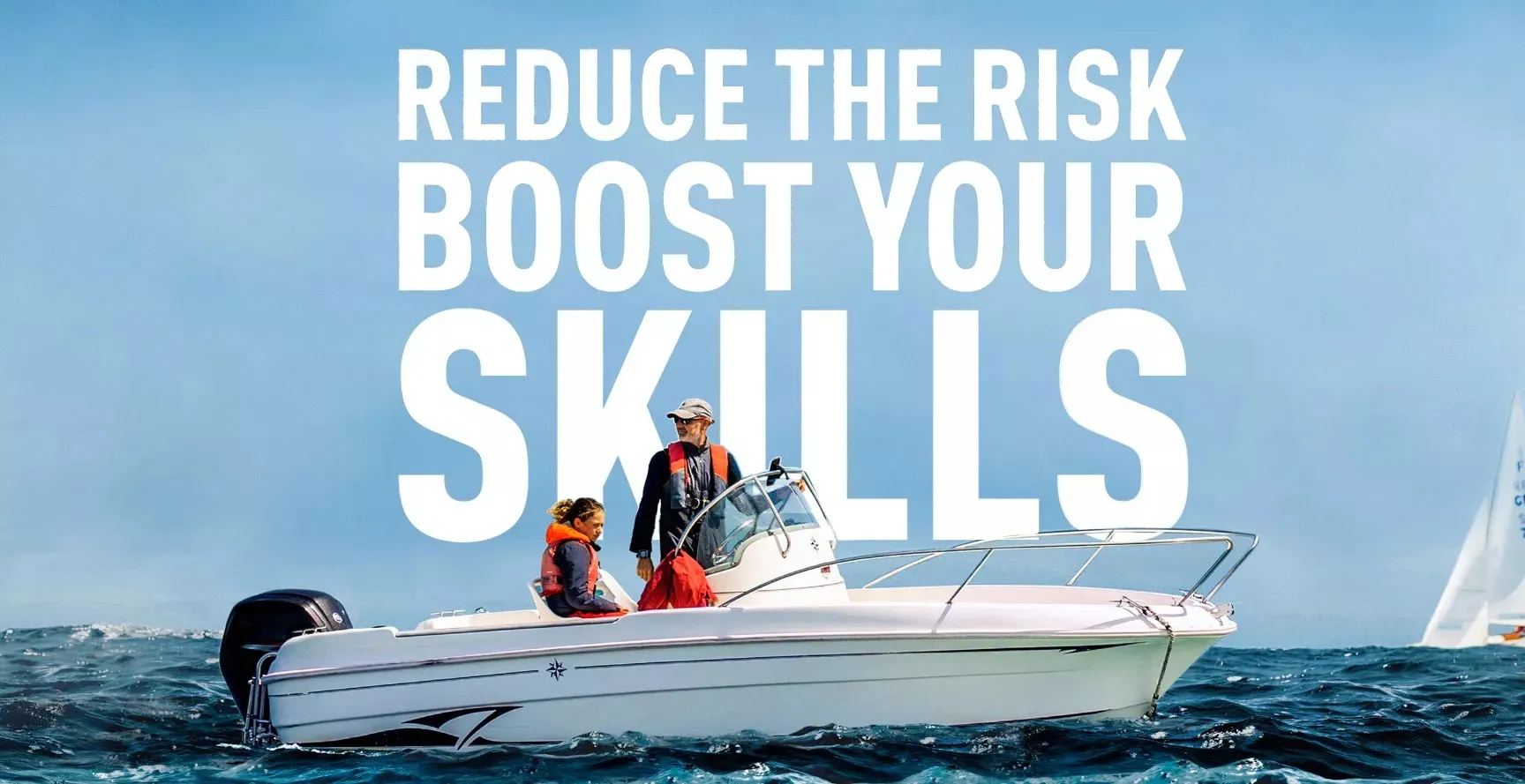 Two people wearing lifejackets on a small white recreational boat in the open sea
