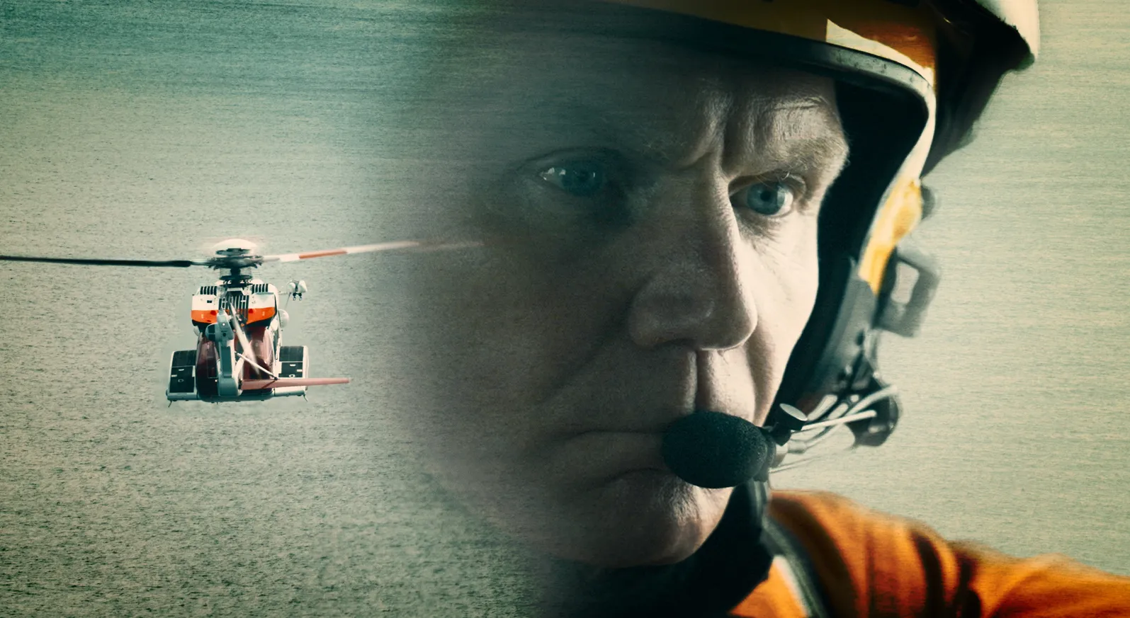 An HM Coastguard helicopter flies in grey skies on the left. On the right, a male helicopter crew's face is overlaid. They are wearing orange overalls and a helmet with a headset.