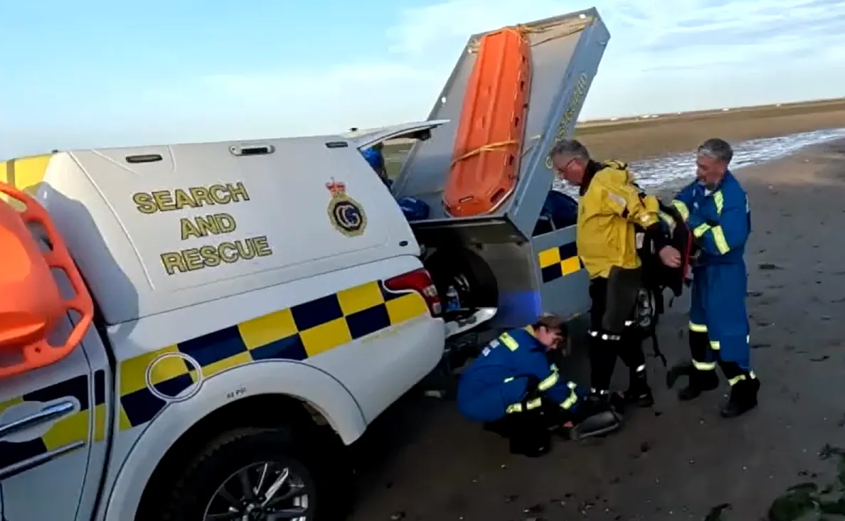 The mud rescue team prepares to reach a casualty