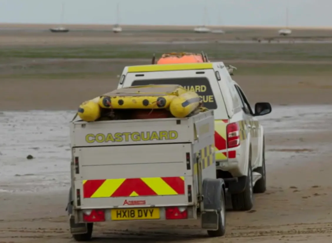 The Coastguard rescue vehicle makes its way onto sands to effect a mud rescue