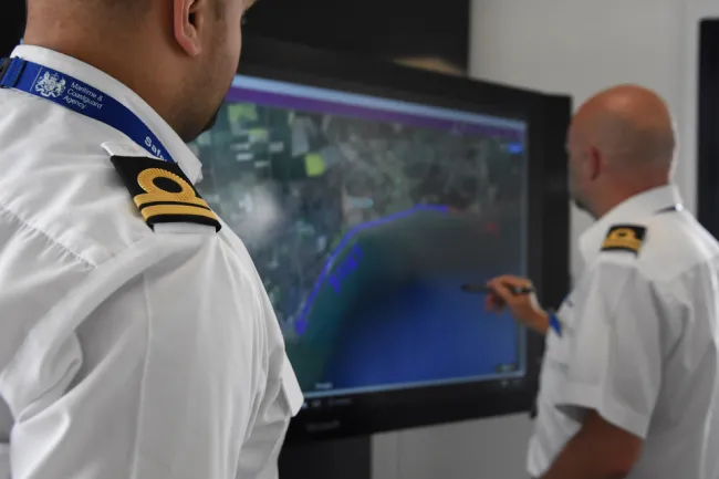 Coastguard officers co-ordinating a response to an incident.