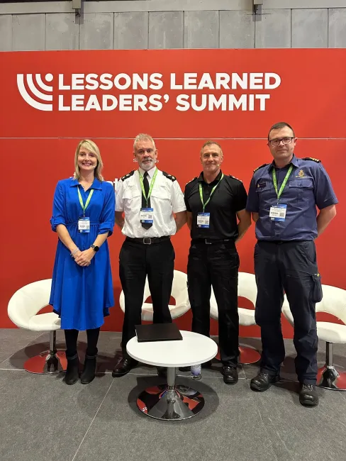 Mike Buratti with male representatives from police and fire, alongside a female convener