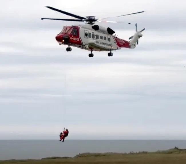 HM Coastguard responds to two paddleboarders stranded near Flamborough Head, Yorkshire.