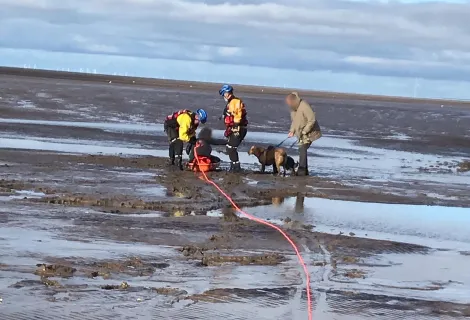 Coastguard officers involved in a mud rescue in the north west