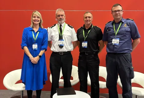 Mike Buratti with male representatives from police and fire, alongside a female convener