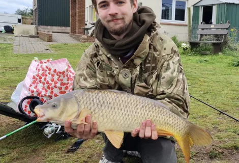 Tom Thorburn pictured with a large fish held in both hands