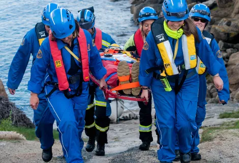 An HM Coastguard Rescue Team extricates a casualty from a coastal location 