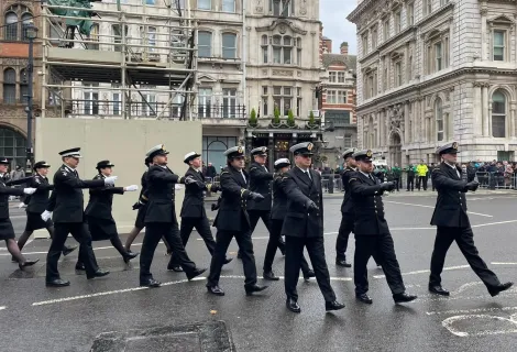 Coastguards in formal uniform marching 