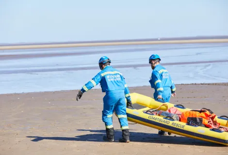 Coastguard Rescue Officers conducting a mud rescue 