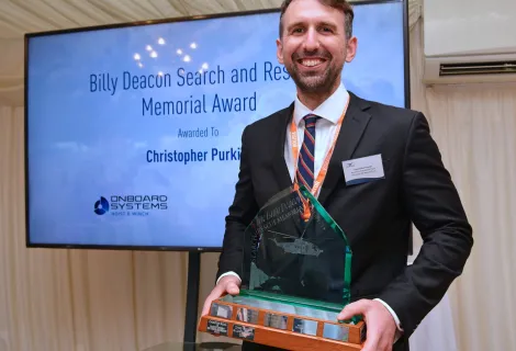 Chris Purkiss, a Winch Paramedic from Lydd’s R163 Coastguard Rescue Helicopter team, received the Billy Deacon SAR Memorial Trophy at the House of Commons as part of the Air League’s Annual Reception Ceremony on 9 July. 