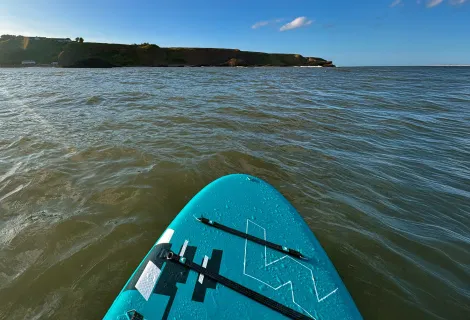 Stand up paddleboarding at Catterline Bay