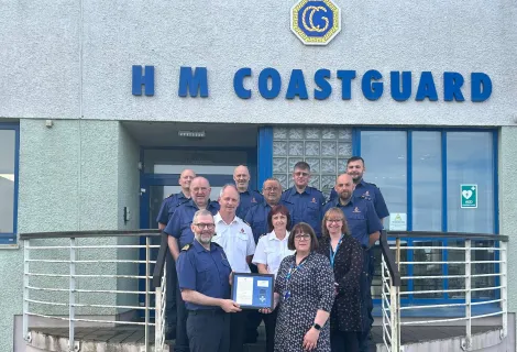 Coastal Operations Area Commander Murdo Macaulay and NHS Western Isles Chief Operating Officer Frances Robertson with HM Coastguard officers at Stornoway MRCC