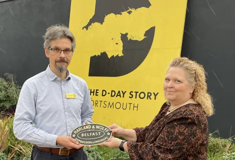 Andrew Whitmarsh is presented with the artefact by Andrea Bailey