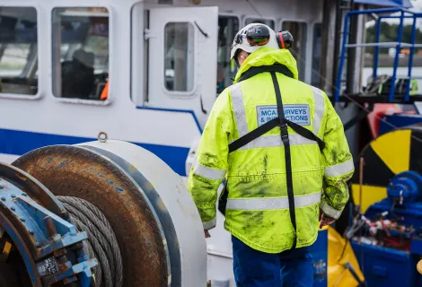 An MCA Surveyor inspects a vessel 