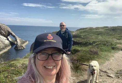 Kate McManus Coyle with her husband Gary and dog Arwen.