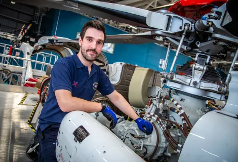 B1 Mechanical Engineer Mike Ratcliffe with a AW139 Search and Rescue Helicopter