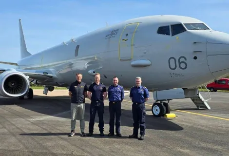 Standing in front of an RAF P8 Poseidon aircraft are, from left, Phillip Johnston, RNLI Area Operations Manager; Andrew Oldfield, Rescue Coordination Centre Manager, Belfast; Ryan Gray, Senior Coastal Operations Officer; Gordon McCreadie, Divisional Commander