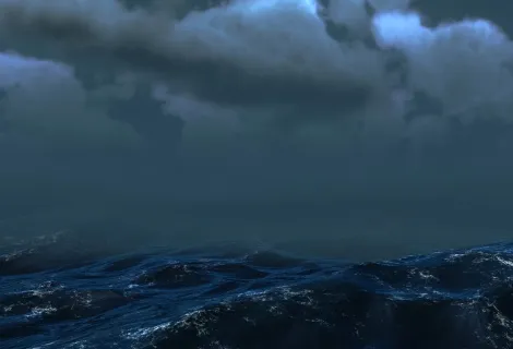 Stormy seas under a dark grey sky