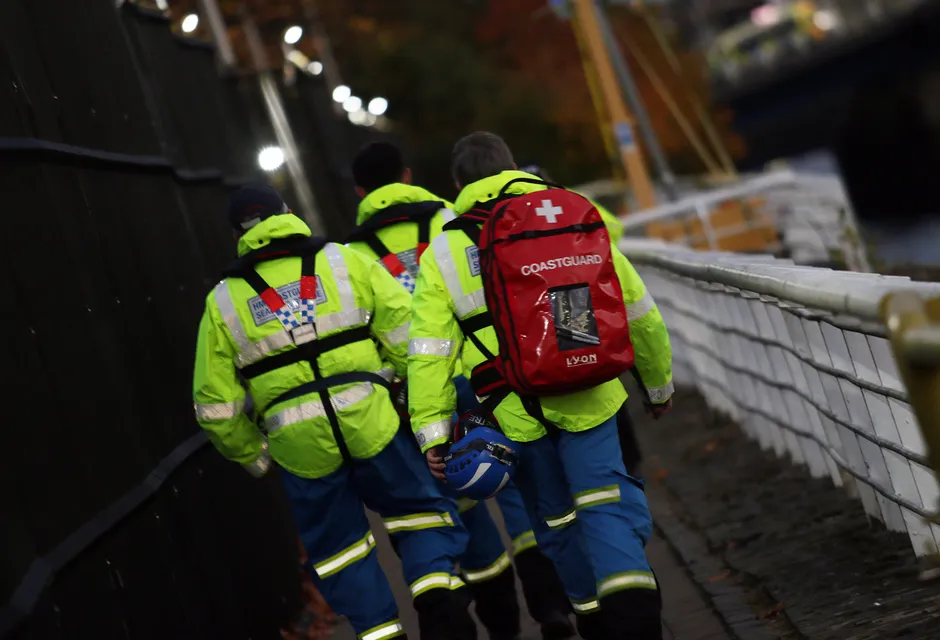HM Coastguard rescue team walking along the Clyde Waterfront ahead of COP26